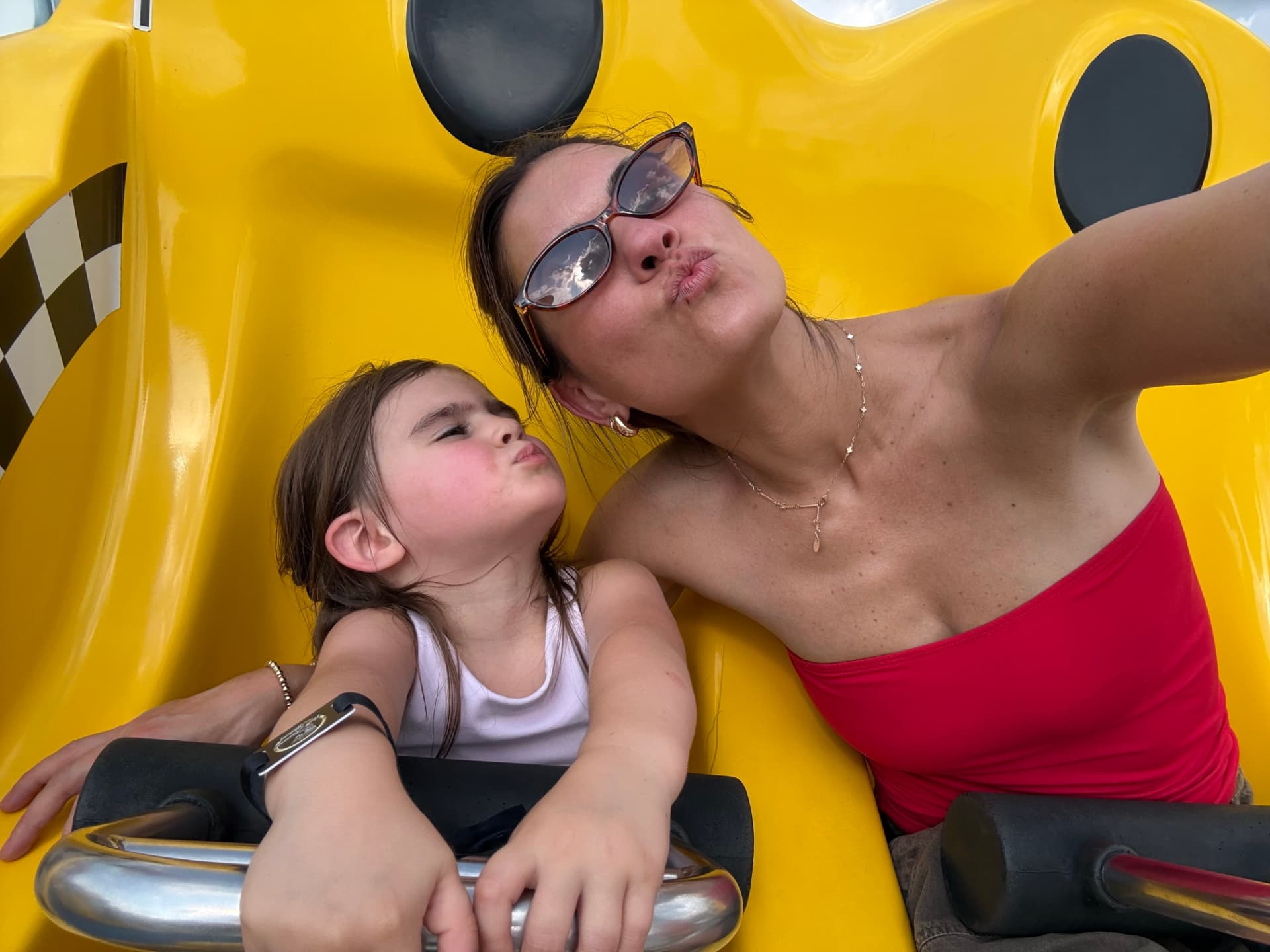 Julia Harmas on a ride with one of their daughters