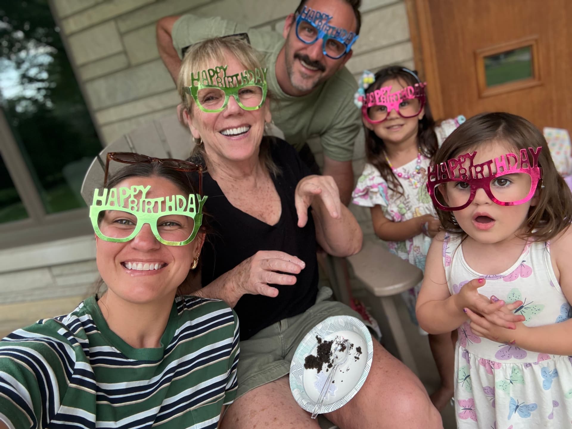 Jay and Julia Harmas with their kids and Sue celebrating a birthday